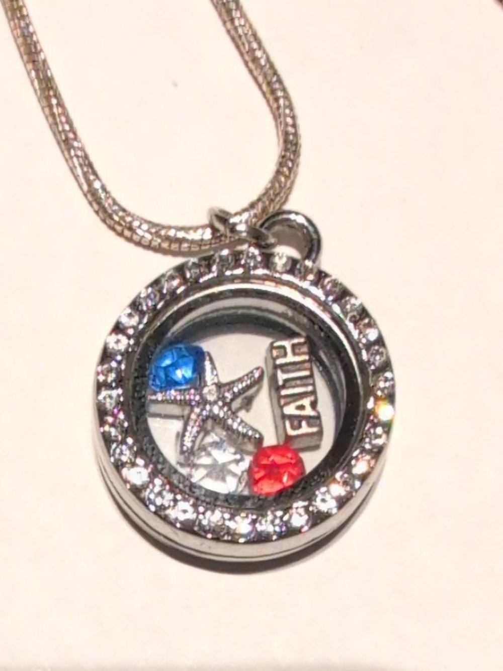 Silver 'Faith' Floating Locket Necklace with Blue and Red Crystals